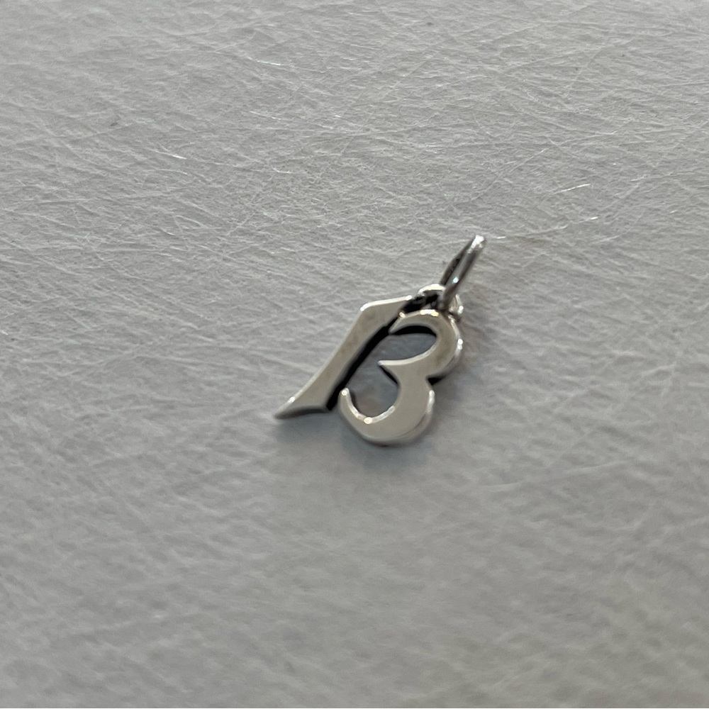 Retired James Avery sterling silver “13” charm